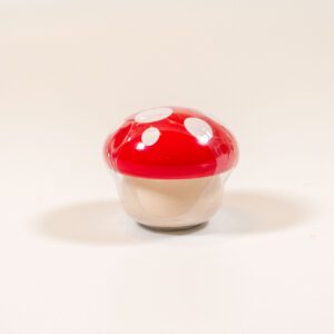 Strawberry lip balm in a cute tiny mushroom