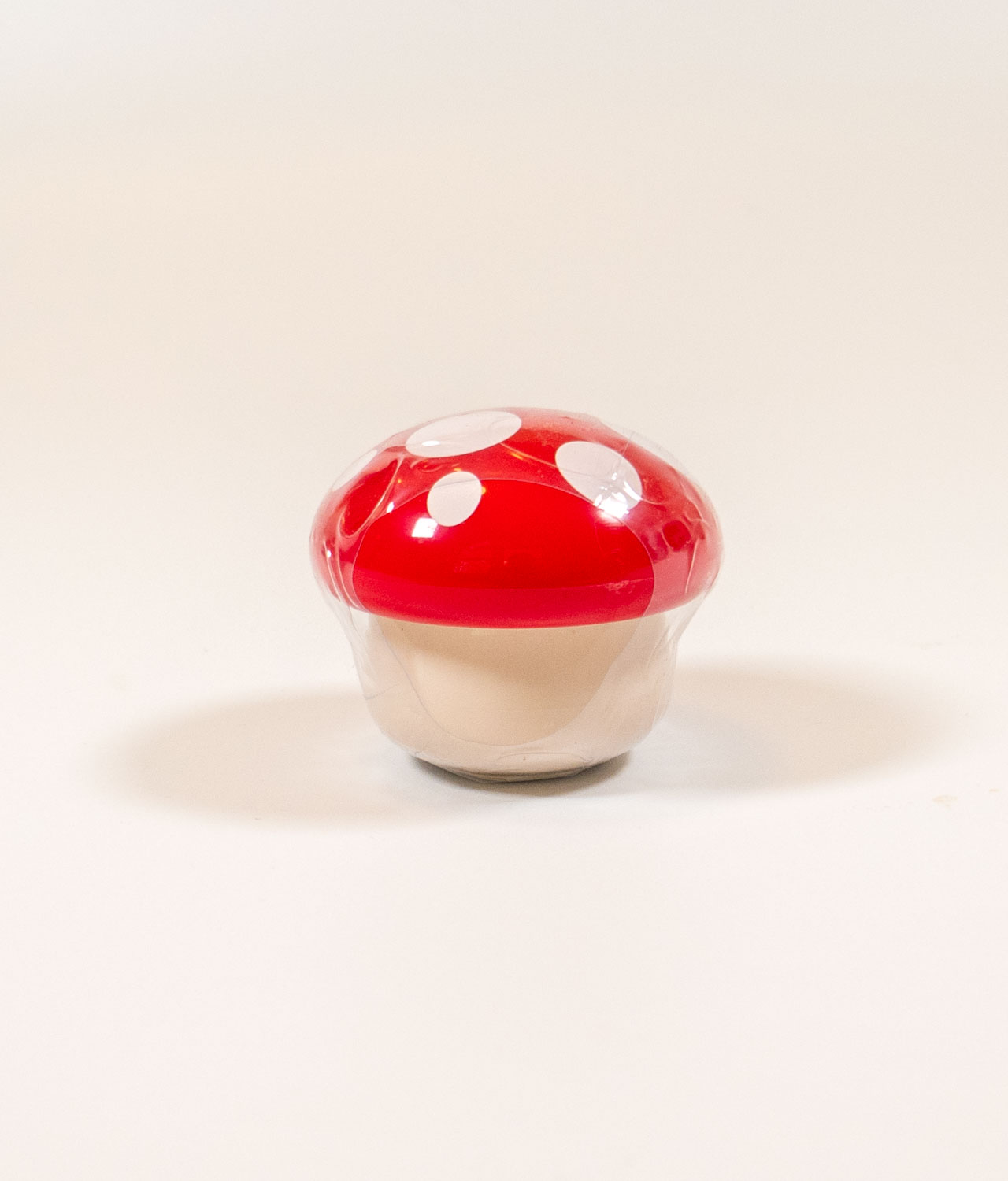 Strawberry lip balm in a cute tiny mushroom