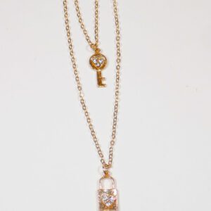 Lock and Key gold necklace on girls neck, beautiful teen jewelry gifts close up