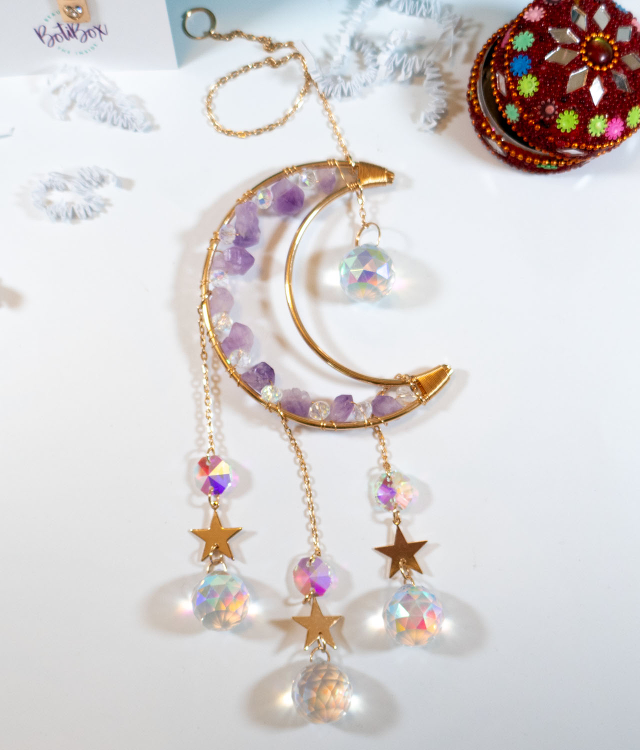 gold moon wall or window hanging featuring crystal prismatic balls, stars, and amethyst gems