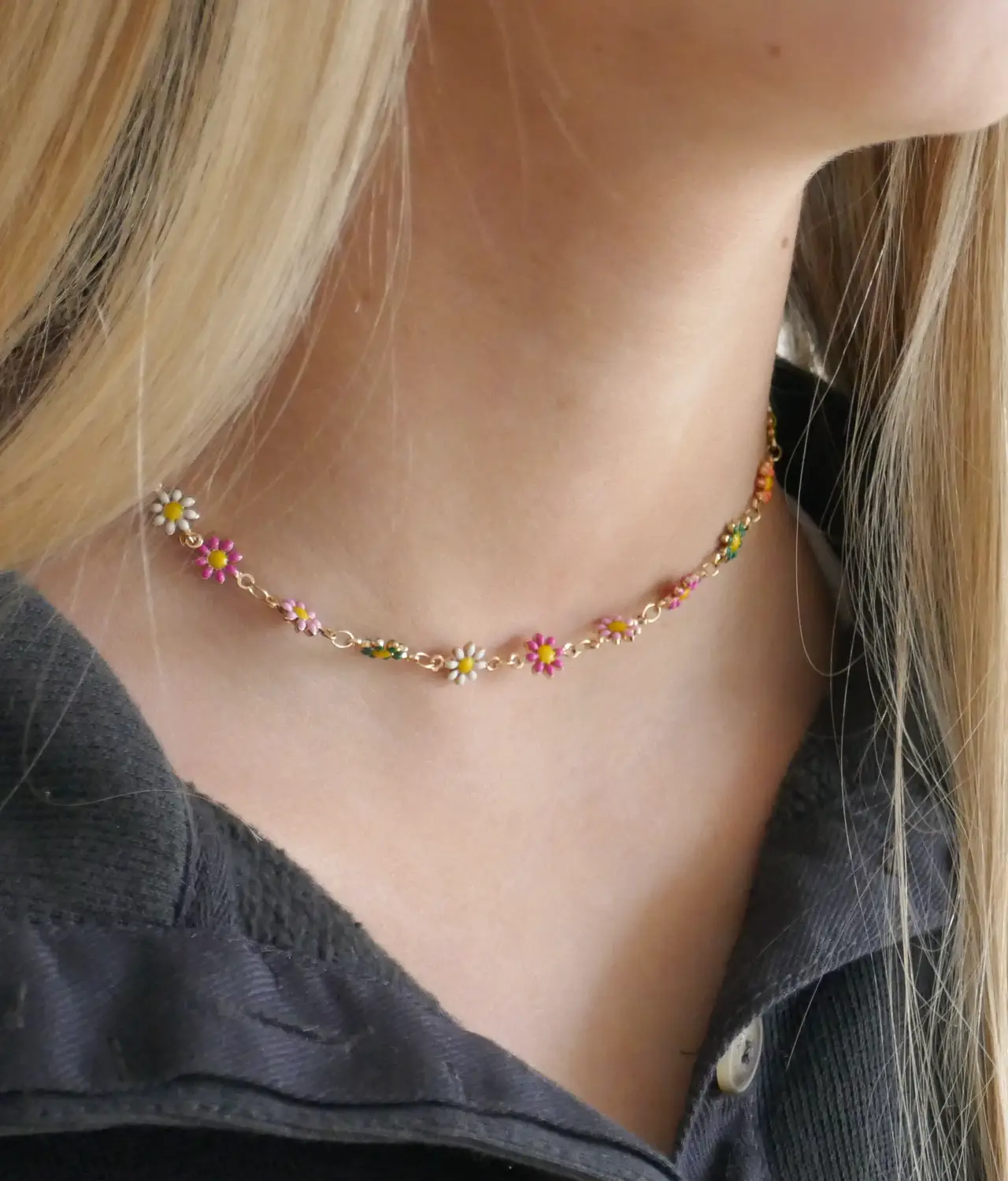 Enamel flower necklace on neck