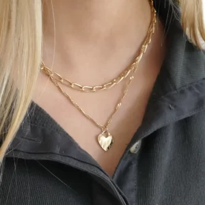 Double chain gold necklace with heart - on girls neck