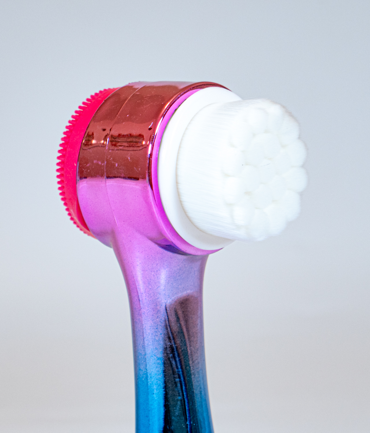 Colorful metallic face scrubber brush for exfoliating microfiber brush closeup