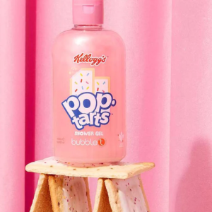Kellogg’s Pop-Tarts Shower Gel bottle with pink frosting design, displayed creatively on stacked Pop-Tarts against a pink curtain background